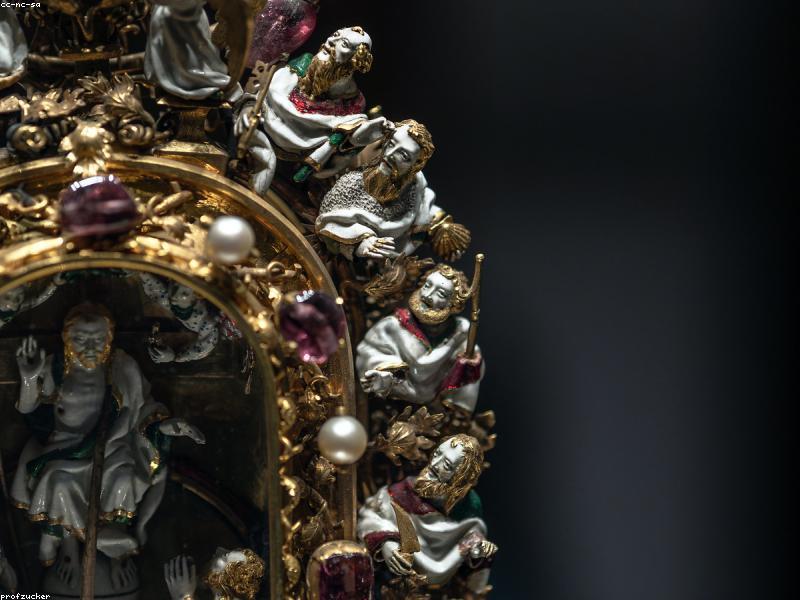 A golden treasure chest with coins and a glowing question mark