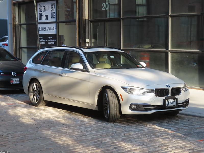 A futuristic self-driving car navigating a city street with a digital sensor overlay