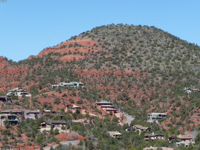 Couple hiking on red rock trail in Sedona with scenic views