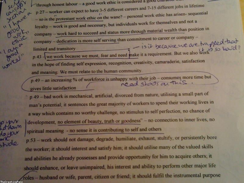 Hand writing notes on paper next to phone