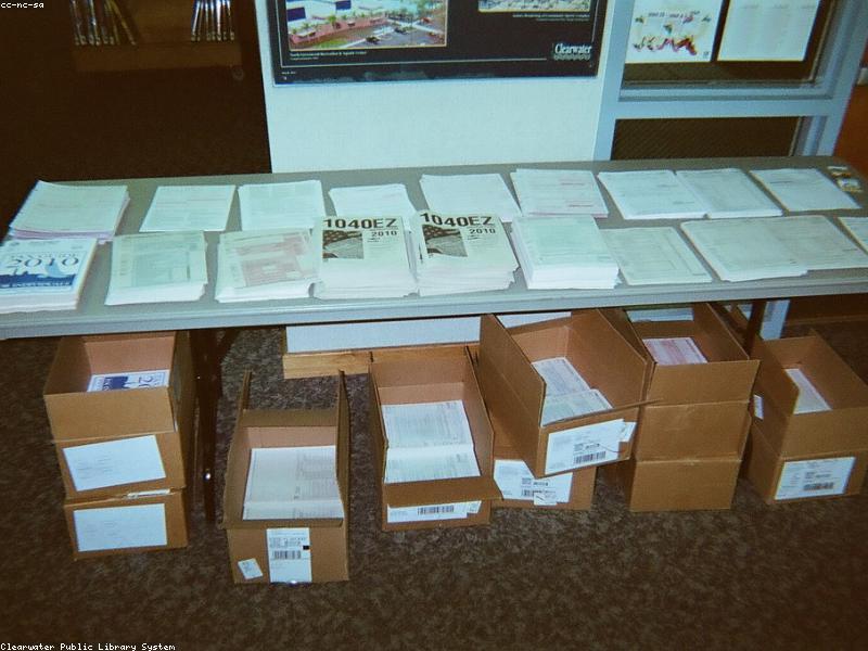Tax forms and calculator on desk